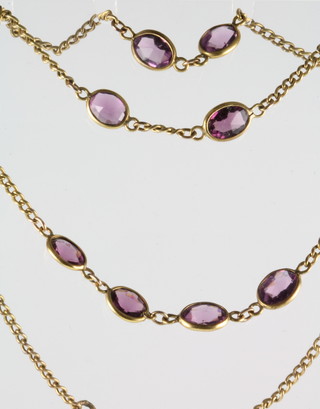 A gilt necklace set with oval cut amethysts with 9ct gold clasp 47" 