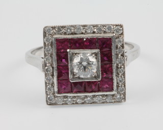 An 18ct white gold Art Deco style ruby and diamond square shaped cocktail ring, size N 