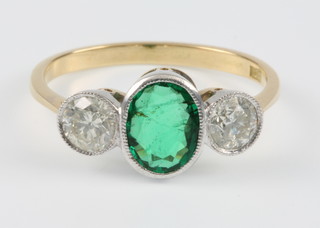 An 18ct yellow gold emerald and diamond 3 stone ring, the centre emerald approx. 1ct flanked by diamond each 0.4ct, size P 