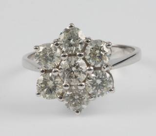 An 18ct white gold 7 stone diamond cluster ring, approx. 2.4ct, size O 1/2