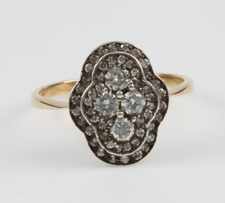 A 15ct yellow gold Edwardian style diamond set quatrefoil ring, approx 0.80ct, size N