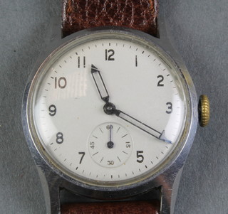 A gentleman's steel cased Army issue wristwatch, the reverse stamped ATP 112826 with seconds at 6 o'clock and open batons, on a leather strap 