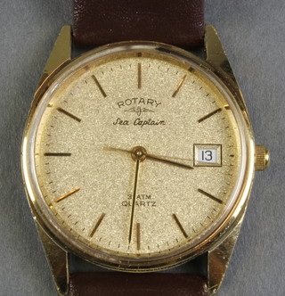 A gentleman's gilt cased Rotary Sea Captain calendar quartz wristwatch on a leather bracelet 