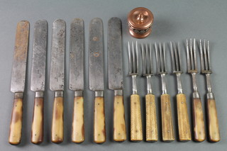 Six pairs of dinner knives and forks with horn handles and steel blades together with a copper salt