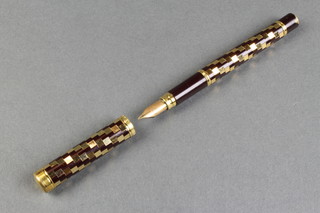 A lady's 1970's Waterman fountain pen with chequer decorated barrel and 18ct nib 