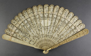 A early 20th Century carved Cantonese ivory fan decorated with figures in an extensive pavilion landscape with vacant cartouche 7"