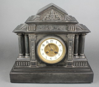 A Victorian striking 8 day mantel clock with porcelain dial and Arabic numerals contained in a black marble architectural case 