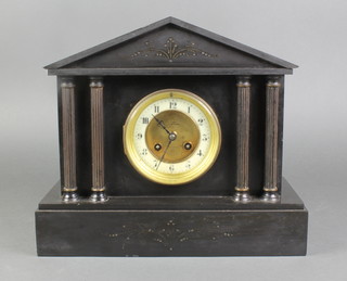A Victorian French 8 day striking mantel clock with porcelain dial and Arabic numerals contained in a black metal architectural case 