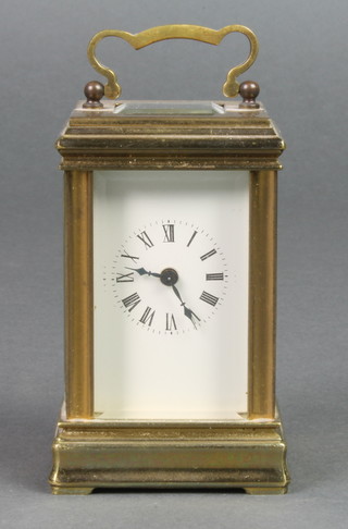 A miniature French carriage timepiece with enamelled dial and Roman numerals, the back plate marked KCG 