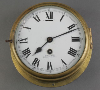 A Smiths ward room style clock with 6 1/2" enamelled dial and Roman numerals marked Smiths Cricklewood NW2 