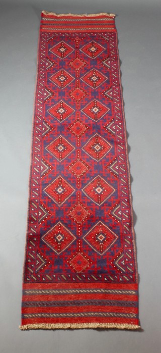 A red ground Meshwani runner with blue and white ground, diamond and hook design 103" x 25"  