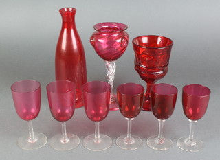 Six Victorian cranberry wines, a ditto vase, bottle and goblet 