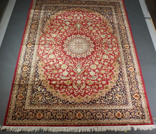 A red ground Belgian cotton Keshan style carpet 110" x 79" 
