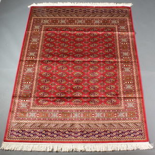 A red ground Belgian cotton Bokhara style rug 76" x 55 1/2" 