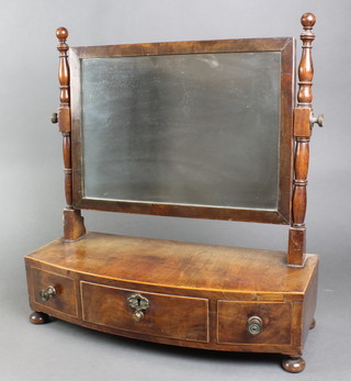 A 19th Century rectangular bevelled plate toilet mirror, contained in a mahogany frame with bow front base fitted 1 long and 2 short drawers, raised on bun supports 19"h x 18 1/2"w x 8"d 