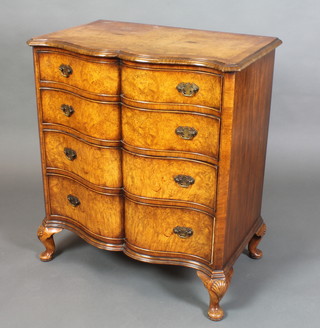 A Queen Anne style walnut serpentine fronted chest with three-quarter veneered and crossbanded top, fitted 4 long graduated drawers and raised on cabriole supports with shell carved knees 34"h x 30"w x 19"d 