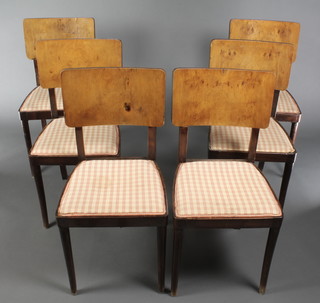 A set of 6 Art Deco walnut dining chairs with solid backs, raised on turned supports having gingham upholstered seats 