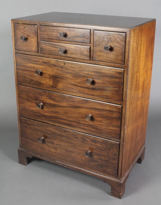 An Art Deco Maples style mahogany chest of 2 short drawers flanked by 2 short drawers above 3 long graduated drawers with tore handles, raised on bracket feet 39 1/2"h x 29 1/2"w x 18"d 