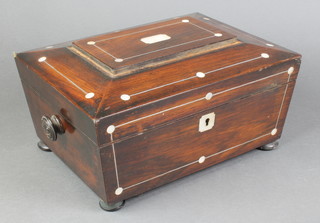 A Victorian rosewood and inlaid mother of pearl cushion shaped sewing box with hinged lid and turned handles to the side, raised on bun supports 5 1/2"h x 12"w x 9"d 