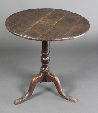 A 19th Century oak tea table, the top formed of 5 planks, raised on turned column and tripod base 27"h x 26 1/2"