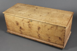 A 19th Century pine trunk with hinged lid and iron lock 19 1/2"h x 47"w x 19"d 