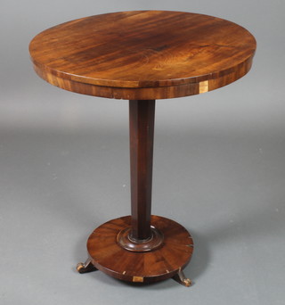 A William IV mahogany circular snap top table, raised on a chamfered column with scroll feet 28"h x 23" diam.  