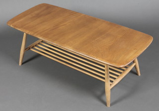 Ercol, a light elm rectangular coffee table with rail under tier, raised on turned supports 14"h x 41"l x 18"d 
