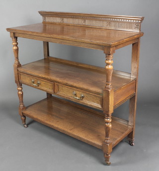 A Victorian light oak 3 tier buffet with raised back fitted 2 drawers, raised on turned supports 48 1/2" x 48"w x 20"d 