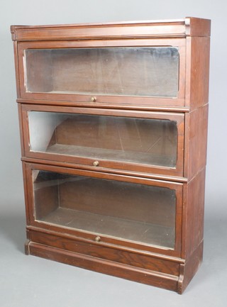 An oak Globe Wernicke style 3 tier bookcase enclosed by panelled doors 49"h x 36"w x 13"d 