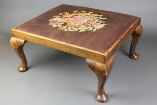 A square mahogany footstool with Berlin wool work tapestry drop in seat, raised on cabriole supports 11"h x 22"w x 19"d 