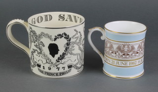 A Wedgwood Silver Jubilee commemorative mug, a Prince William of Wales ditto 