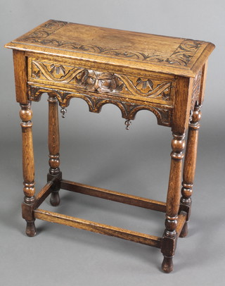 A Victorian rectangular carved oak side table fitted a drawer with lion mask handle raised on turned and block supports 32"h x 26"w x 12"d 