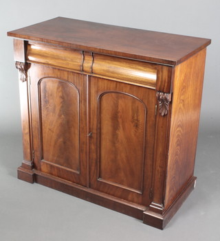 A Victorian mahogany chiffonier, fitted 1 long drawer above a cupboard fitted 2 short and 2 long drawers with brass countersunk handles enclosed by arched panelled doors 37"h x 40"w x 19 1/2"d 
