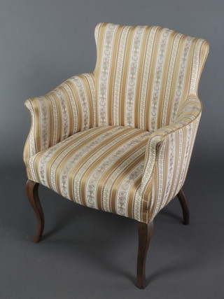 A Georgian style armchair upholstered in yellow material 