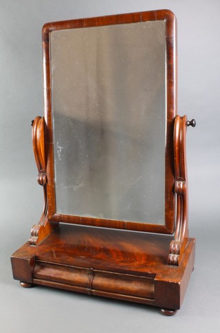 A Victorian rectangular plate toilet mirror contained in a mahogany frame, the base fitted 2 long drawers, raised on bun supports 30"h x 20 1/2"w x 10"d 