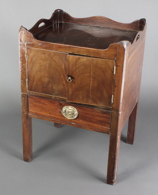 A Georgian mahogany tray top commode fitted a cupboard enclosed by a panelled door above 1 long drawer, raised on square supports 31"h x 21"w x 18 1/2"d 