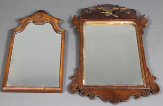 A Chippendale style arched plate mirror contained in a walnut frame 24" x 12" and 1 other Chippendale style mirror surmounted by a figure of a griffin (f) 29" x 17 1/2" 
