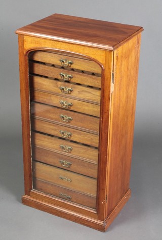 A Victorian mahogany collectors cabinet fitted 11 drawers enclosed by arched panelled glazed door 37"h x 19"w x 13 1/2"d 