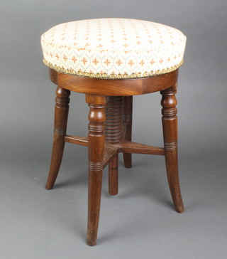 A Victorian mahogany adjustable piano stool raised on 4 turned columns and with X framed stretcher 16"h x 14" diam. 