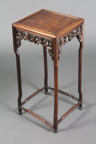 A square Padouk occasional table with carved and pierced apron, raised on turned supports 27"h x 12" x 12 1/2"