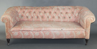 A Victorian Chesterfield upholstered in buttoned back floral material 27"h x 78"w x 31"d 