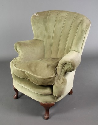A Georgian style tub back armchair upholstered in green material on cabriole supports 