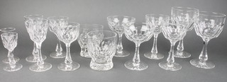 A 50 piece suite of panel cut glasses comprising 10 champagne flutes, 12 wine glasses, 4 sherry glasses, 6 tumblers, 8 liqueur glasses, 8 port glasses and 2 sherry glasses 