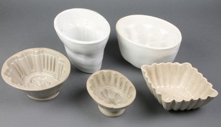 A collection of 5 19th Century pottery jelly moulds