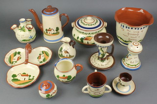 A good collection of various Longpark Torquay and other Torquay mottoware including jardiniere, 3 triangular graduated jugs, biscuit barrel and cover, etc, etc, 