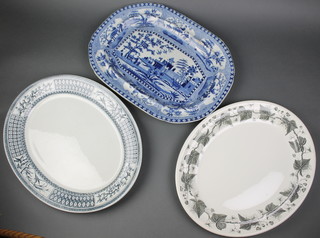 A 19th Century blue and white meat plate decorated figures by a building 19" (cracked), a Victorian oval blue and white meat plate 18" and a Napoleon Ivy patterned meat plate 17" 