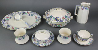 A 40 piece Doulton Burslem Nankin pattern dinner service comprising 3 graduated meat plates, 2 tureens and covers (1 cracked), 7 dinner plates (1 cracked), 6 side plates (3 cracked), 5 tea plates, 2 lidded butter dishes (1 cracked), 2 waisted bowls, jar (no lid), 6 tea cups (4 cracked), 5 saucers (3 cracked) 
