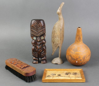A carved gourd 7", a Maori style carved wooden figure 8", ditto brush, a figure of a bird and a papayas drawing