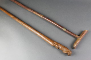 A Sir Jeffery Hillpig-Smyth stick together with a  carved wooden stick, the head decorated a seated monkey 