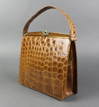 A crocodile handbag with gilt metal mounts 